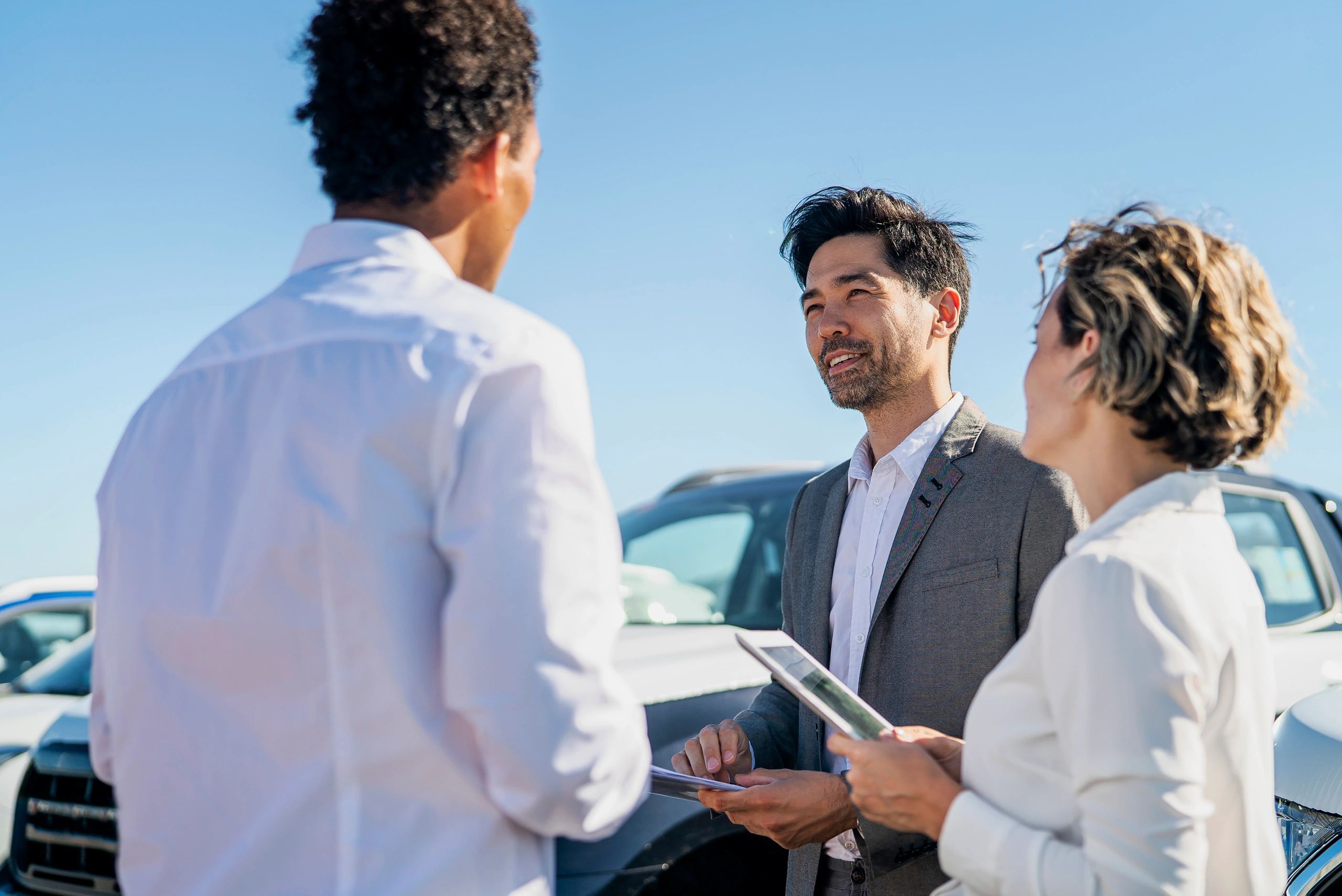Agent Wheels team members at a dealership lot