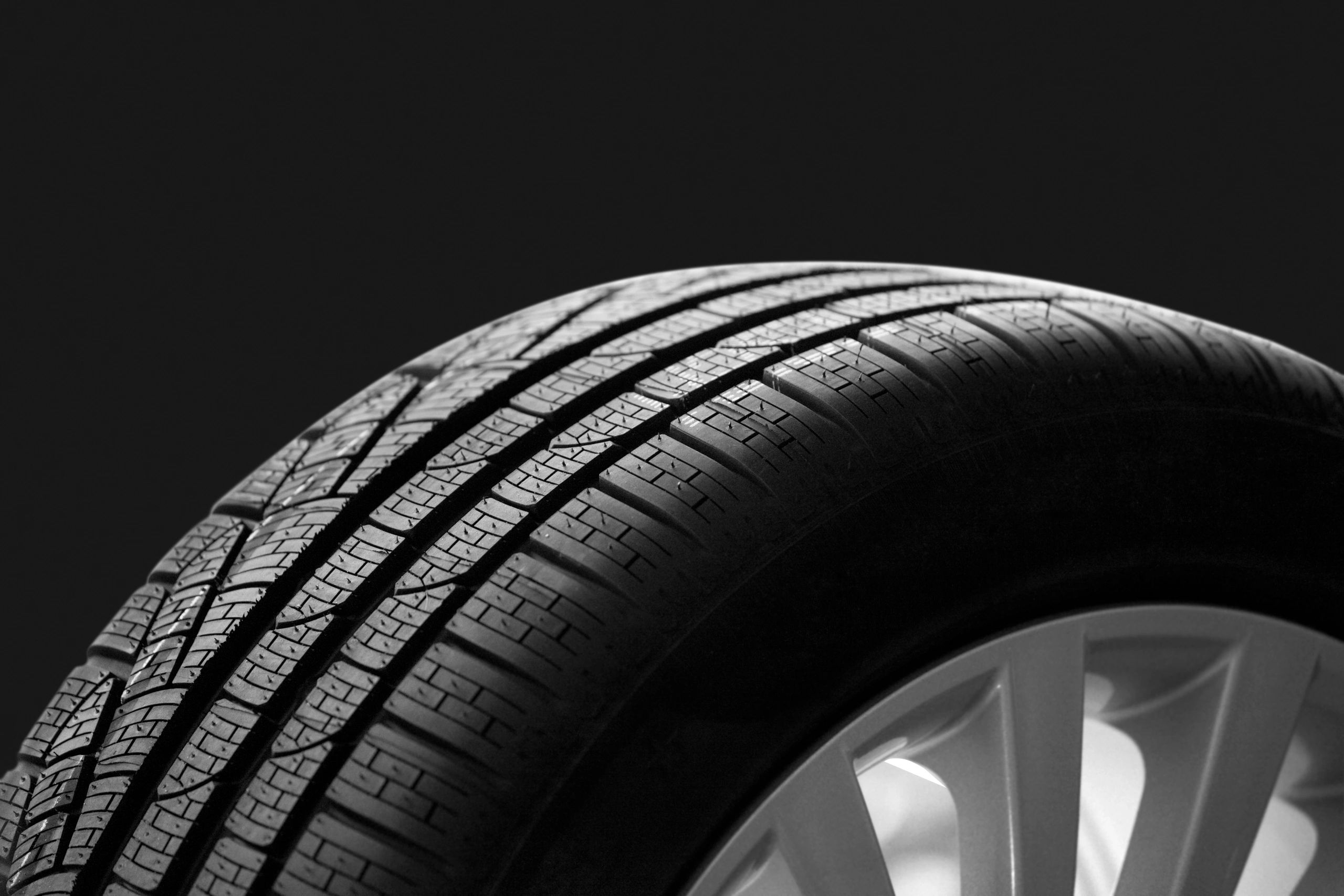 Premium tire and wheel detail on dark background