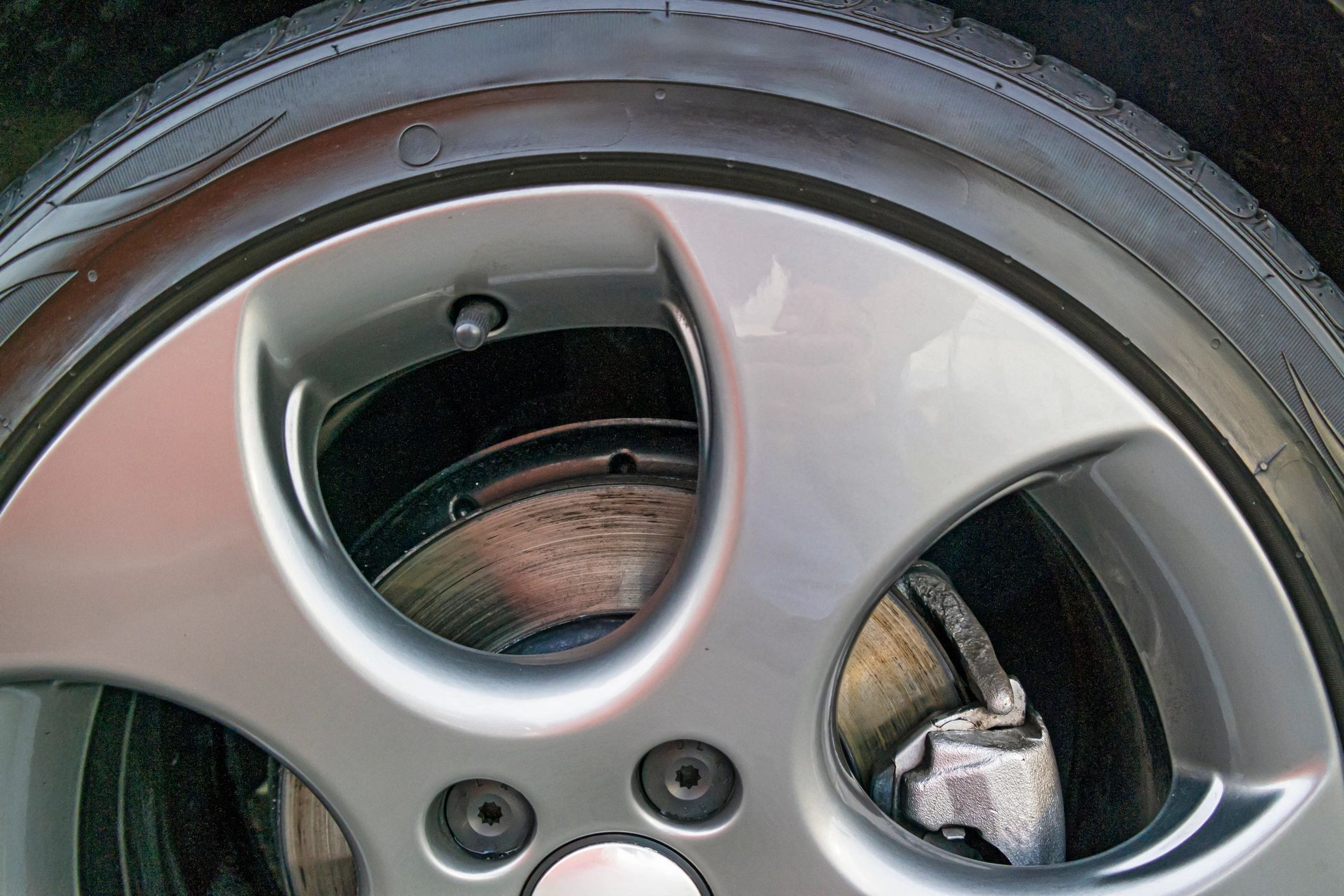Close-up of alloy wheel and brake caliper